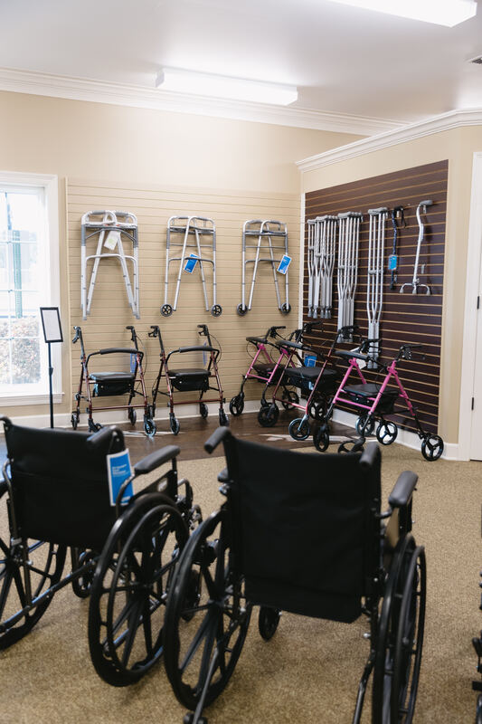 Walkers, rollators, crutches, and wheelchairs on display at Mitchell's Pharmacy